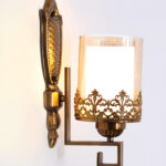 Antique Golden Wall Sconce with Ornate Clear Glass Shade