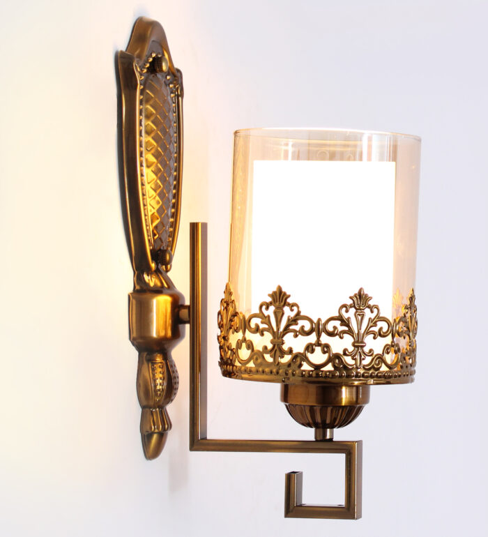 Antique Golden Wall Sconce with Ornate Clear Glass Shade