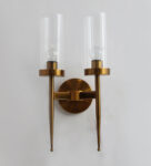 Golden Finish Wall Light With Cylindrical Dual Arm | Clear Glass