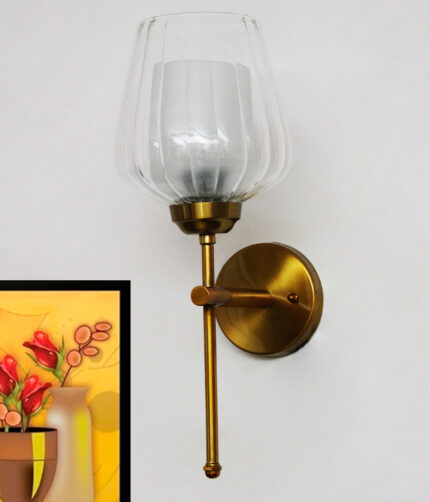 Ribbed Glass Lamp wall light with clear textured glass shade and brushed gold metal base mounted on a white wall, providing elegant ambient lighting for modern interiors.