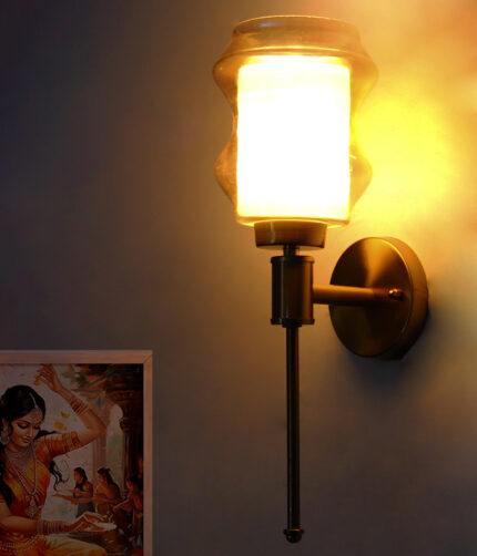 Lamp Amber Glass wall light with sculpted amber shade and brass finish, featuring a vertical stem design and warm ambient illumination