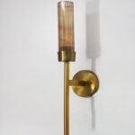 Smokey Glass wall light with tinted glass shade and sleek metal mount on white background