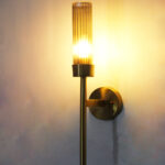 Smokey Glass wall light with tinted glass shade and sleek metal mount on white background