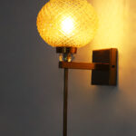 Amber Diamond Cut wall lamp with textured amber glass shade, brass finish body, and decorative crystal accent for elegant interior lighting