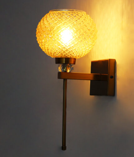 Amber Diamond Cut wall lamp with textured amber glass shade, brass finish body, and decorative crystal accent for elegant interior lighting