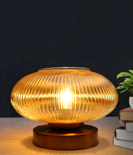 Kachori Glass Table Lamp with wide ribbed amber glass shade, brass finish round base, decorative modern bedside and living room table lamp design