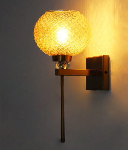 Amber Diamond Cut wall lamp with textured amber glass shade, brass finish body, and decorative crystal accent for elegant interior lighting