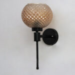 Diamond Glass Black Wall Sconce with amber textured glass globe shade and matte black metal wall mount for modern decorative indoor lighting
