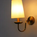 White Fabric Shade Wall Lamp with antique brass finish and curved arm wall sconce for bedroom, living room, and hallway décor