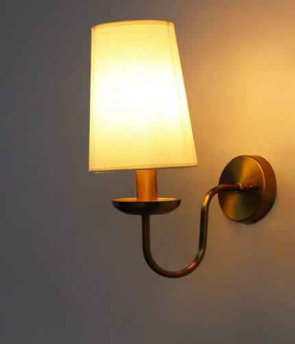 White Fabric Shade Wall Lamp with antique brass finish and curved arm wall sconce for bedroom, living room, and hallway décor