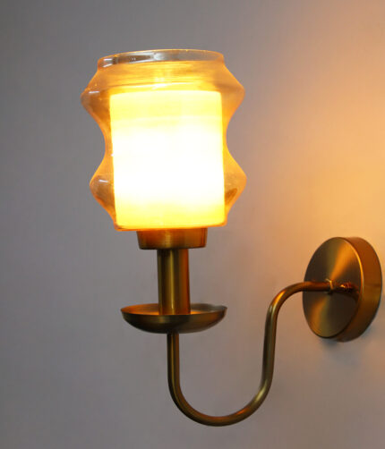 Damru Glass Wall Sconce with amber designer glass shade and brass finish curved arm decorative wall lamp for bedroom and living room