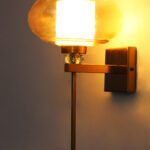 Amber Kachori Glass wall light with wide round amber glass shade, brass finish wall mount, crystal accent, and decorative luxury wall sconce design