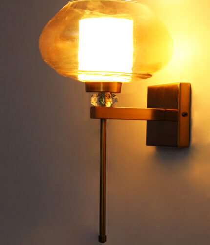 Amber Kachori Glass wall light with wide round amber glass shade, brass finish wall mount, crystal accent, and decorative luxury wall sconce design