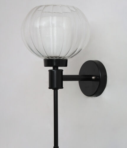 Clear Kharbuja Glass wall light with clear ribbed glass globe shade and matte black metal wall mount for elegant modern indoor lighting