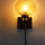 Amber Diamond Cut wall lamp with textured amber glass shade, brass finish body, and decorative crystal accent for elegant interior lighting