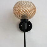 Diamond Glass Black Wall Sconce with amber textured glass globe shade and matte black metal wall mount for modern decorative indoor lighting