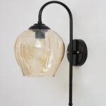 Amber Glass Black Wall Light with amber glass hanging shade and matte black curved metal wall mount for elegant modern indoor lighting
