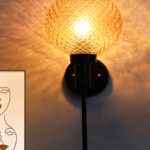 Diamond Glass Black Wall Sconce with amber textured glass globe shade and matte black metal wall mount for modern decorative indoor lighting