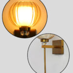 Amber Kharbuja Wall Sconce with amber melon-shaped glass shade, brass finish body, crystal accent, and decorative wall lighting design
