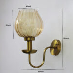 Ribbed Tulip Glass Wall Light with amber ribbed glass shade and brass finish curved arm decorative wall lamp for bedroom and living room