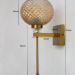 Amber Diamond Cut wall lamp with textured amber glass shade, brass finish body, and decorative crystal accent for elegant interior lighting