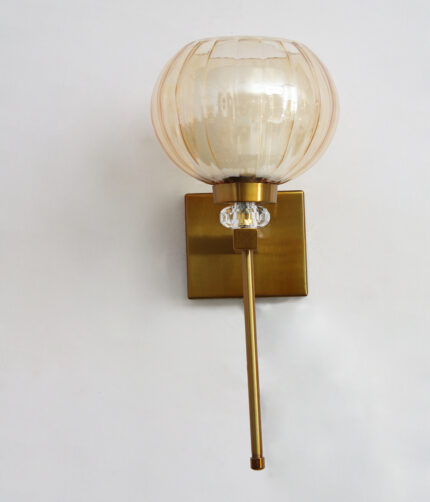 Amber Kharbuja Wall Sconce with amber melon-shaped glass shade, brass finish body, crystal accent, and decorative wall lighting design