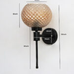 Diamond Glass Black Wall Sconce with amber textured glass globe shade and matte black metal wall mount for modern decorative indoor lighting