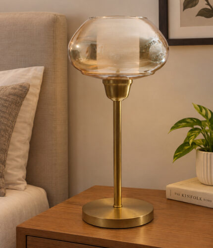 Amber Kachori Vintage table lamp with rounded amber glass shade and brass base, providing warm decorative lighting for bedside or living room use