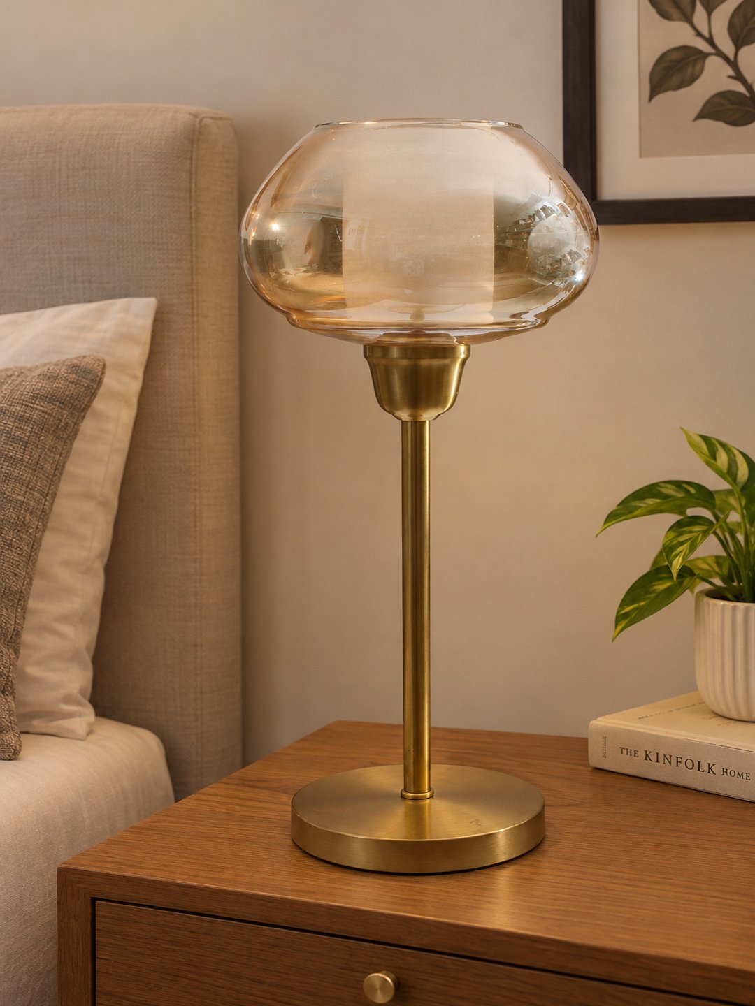 Amber Kachori Vintage Table Lamp Amber Kachori Vintage table lamp with rounded amber glass shade and brass base, providing warm decorative lighting for bedside or living room use