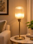 Elara Ribbed Cylinder table lamp with tall ribbed glass shade and brass base, modern decorative lighting for bedside, living room, or workspace