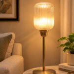 Elara Ribbed Cylinder table lamp with tall ribbed glass shade and brass base, modern decorative lighting for bedside, living room, or workspace