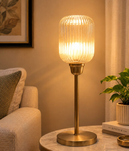 Elara Ribbed Cylinder table lamp with tall ribbed glass shade and brass base, modern decorative lighting for bedside, living room, or workspace