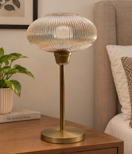Aurora Ribbed Glass table lamp with wide ribbed amber glass shade and brass base, modern decorative lighting for bedside or living room use