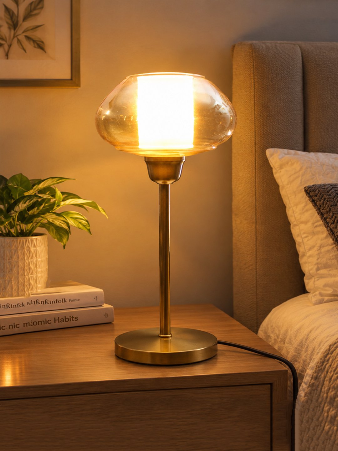 Amber Kachori Vintage Table Lamp Amber Kachori Vintage table lamp with rounded amber glass shade and brass base, providing warm decorative lighting for bedside or living room use