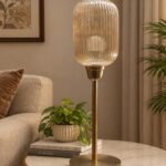 Elara Ribbed Cylinder table lamp with tall ribbed glass shade and brass base, modern decorative lighting for bedside, living room, or workspace