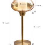 Amber Kachori Vintage table lamp with rounded amber glass shade and brass base, providing warm decorative lighting for bedside or living room use