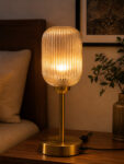 Elara Ribbed Cylinder table lamp with tall ribbed glass shade and brass base, modern decorative lighting for bedside, living room, or workspace