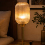 Elara Ribbed Cylinder table lamp with tall ribbed glass shade and brass base, modern decorative lighting for bedside, living room, or workspace