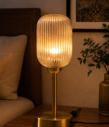Elara Ribbed Cylinder table lamp with tall ribbed glass shade and brass base, modern decorative lighting for bedside, living room, or workspace