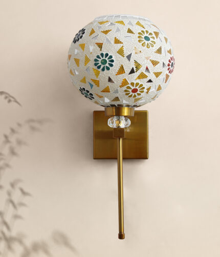 White Tipni Colourful Glass wall light with mosaic dome shade, floral and geometric patterns, and brass finish arm for decorative ambient lighting