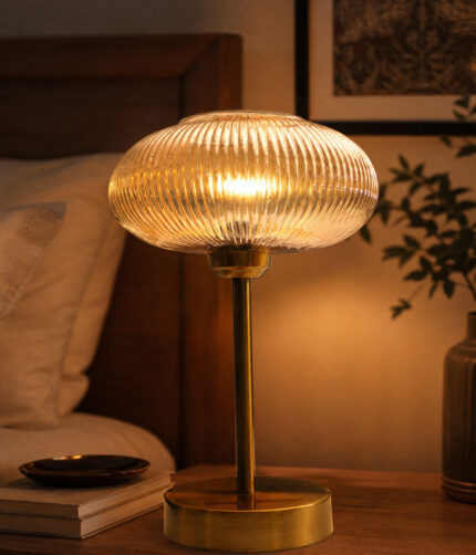 Aurora Ribbed Glass table lamp with wide ribbed amber glass shade and brass base, modern decorative lighting for bedside or living room use