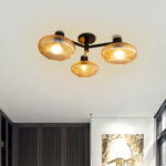 Solara 3-Light chandelier with three ribbed amber glass shades and a matte black metal frame, modern semi-flush ceiling light for dining rooms, living rooms, kitchens, and bedrooms.