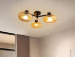 Solara 3-Light chandelier with three ribbed amber glass shades and a matte black metal frame, modern semi-flush ceiling light for dining rooms, living rooms, kitchens, and bedrooms.