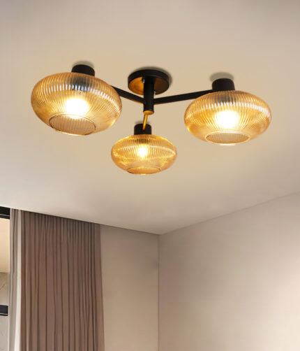 Solara 3-Light chandelier with three ribbed amber glass shades and a matte black metal frame, modern semi-flush ceiling light for dining rooms, living rooms, kitchens, and bedrooms.