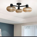 Solara 3-Light chandelier with three ribbed amber glass shades and a matte black metal frame, modern semi-flush ceiling light for dining rooms, living rooms, kitchens, and bedrooms.