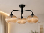 Ribbed Glass Chandelier with three amber ribbed glass shades and a matte black metal frame, modern semi-flush ceiling light for dining room, living room, and kitchen.