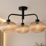 Ribbed Glass Chandelier with three amber ribbed glass shades and a matte black metal frame, modern semi-flush ceiling light for dining room, living room, and kitchen.