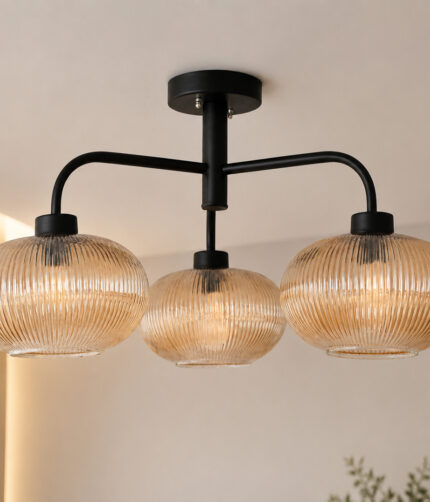 Ribbed Glass Chandelier with three amber ribbed glass shades and a matte black metal frame, modern semi-flush ceiling light for dining room, living room, and kitchen.