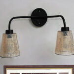 Florence Ribbed Glass dual-light wall sconce with textured ribbed glass shades and a matte black metal frame, perfect for modern bedrooms, hallways, living rooms, and dining spaces.
