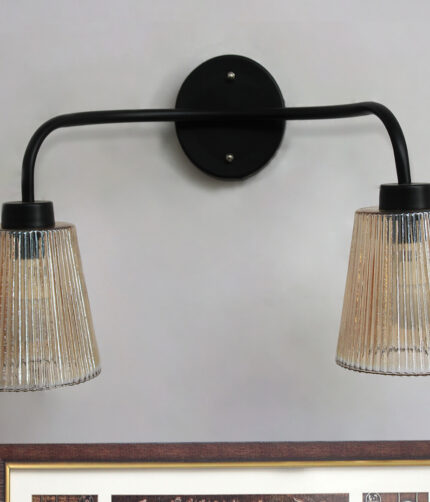 Florence Ribbed Glass dual-light wall sconce with textured ribbed glass shades and a matte black metal frame, perfect for modern bedrooms, hallways, living rooms, and dining spaces.